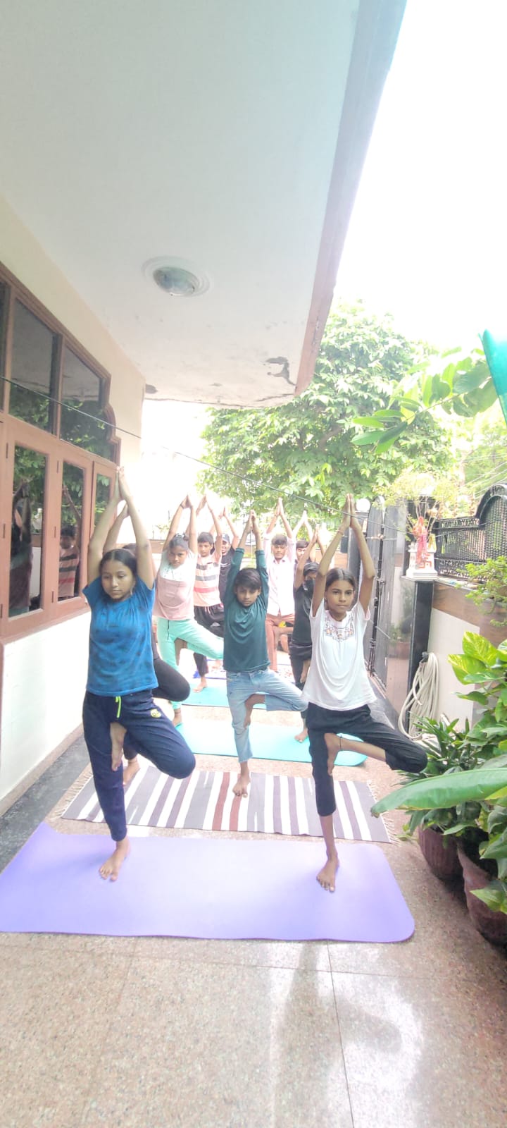 Outdoor children tree pose balancing session